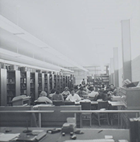 Black and white interior photo of study area inside Grant Hall Library