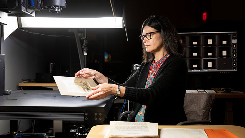 Archival materials being digitized on giant scanner