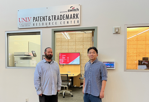Patrick Griffis and Youngwoo Ban stand outside the UNLV Libraries Patent & Trademark Resource Center powered by Switch.