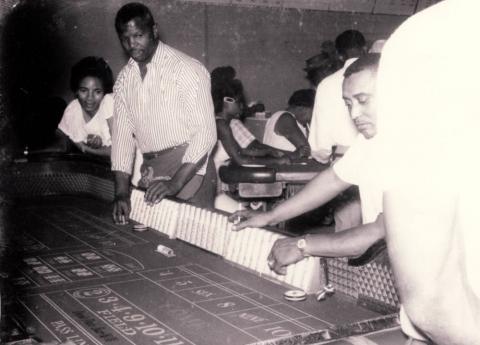 Three patrons at the craps table in the El Rio Club on the Westside, circa 1960s.