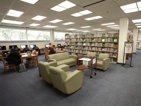 Chairs and book shelves inside Teacher Development and Resources Library.