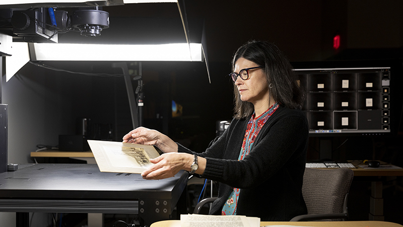 Archival materials being digitized on giant scanner