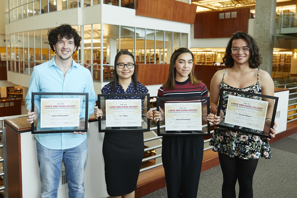 Students pictured left to right are James Marmaduke, Ei Myint, Karsyn Wilson, and Aariel Armstrong all holding framed certificates