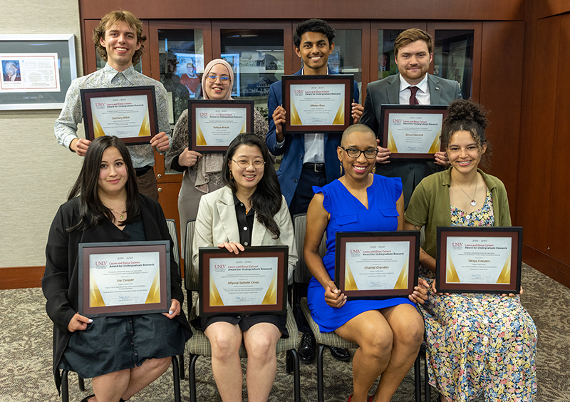 Photo of the eight 2023 Lance and Elena Calvert Award for Undergraduate Research winners holding their framed certificates.