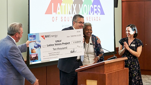 Donors presenting a giant $10,000 check the UNLV Oral History Research Center