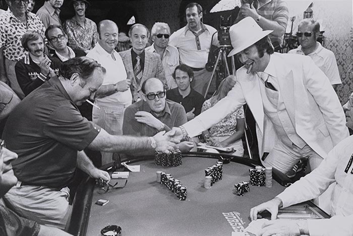 Photograph of two men shaking hands at the Seventh World Series of Poker at the Horseshow Casino from the Binion's Horseshoe Club Photograph Collection (PH-00318).