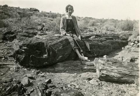 Dorothy Keeler on petrified log at Valley of Fire in Southern Nevada, 1930
