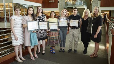 Group photo of Calvert Awards winners holding awards certificate