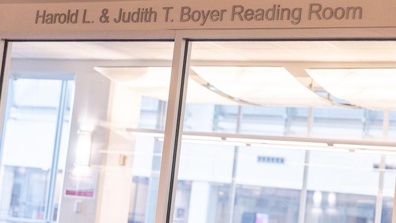 Entrance to the Harold L. & Judith T. Boyer Reading Room with visible glass doors.