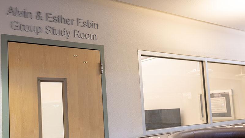 Door to the Alvin & Esther Esbin Group Study Room with windows on the right.