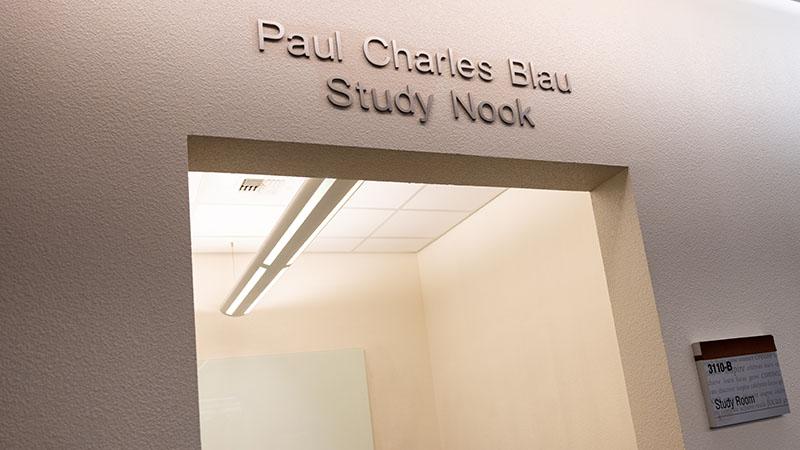 Entrance to Paul Charles Blau Study Nook with fluorescent lighting visible inside.