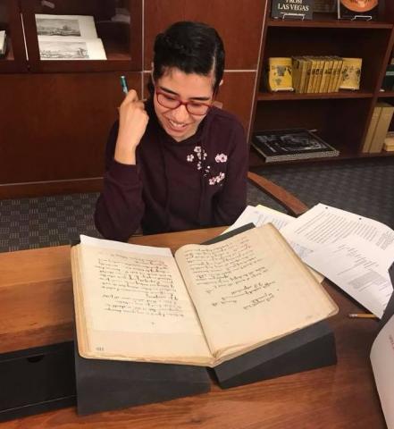 Maribel Estrada Calderon examining the the Fort Mojave Indian School Records.