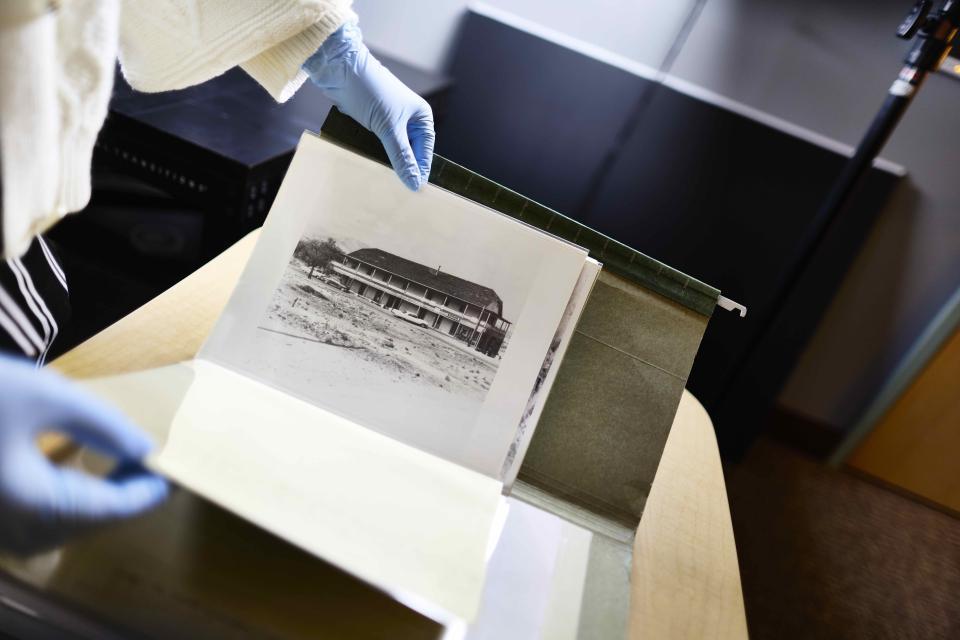 Photograph being scanned in digitization lab