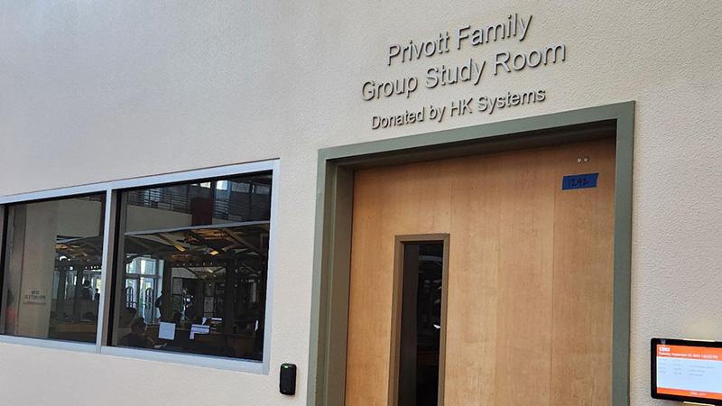 Entrance to the Privott Family Group Study Room with window and door.