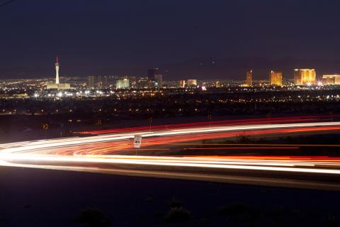Photograph of headlights on the 215 beltway at night, Las Vegas, Nevada, October 04, 2016.  Aaron Mayes, UNLV University Libraries Special Collections.