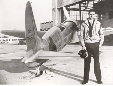 Historical black and white photograph of Howard Hughes with the H-1 Racer, circa 1935-1937