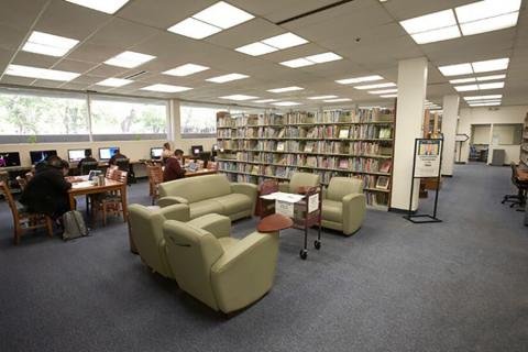 Seating and bookshelves inside the Teacher Development & Resources Library