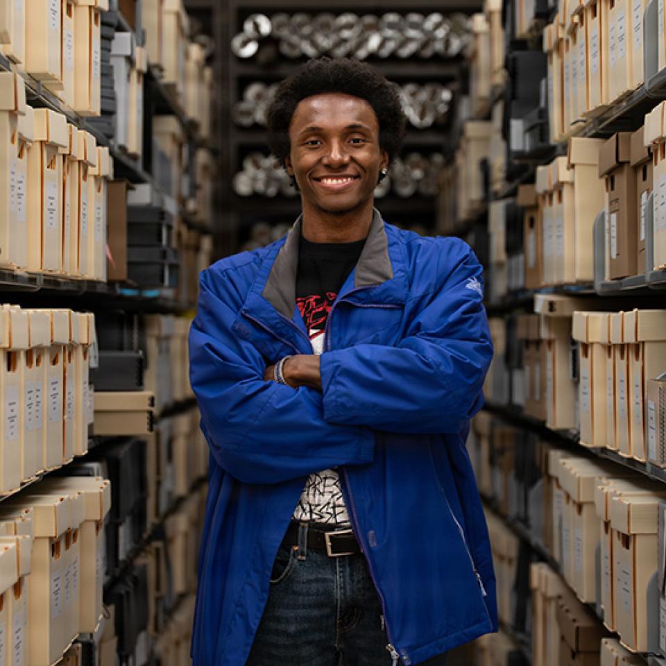 Nellis AFB, UNLV collaborate on preserving the base’s history Malik Ahmad, a digital collections student assistant with the University of Nevada, Las Vegas, stands for a photo at the UNLV Lied Library in Las Vegas, Nevada, April 21, 2026. Ahmad is leading the digitization of more than 50,000 Nellis Air Force Base newspapers.