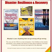 A display titled "Disaster: Resilience & Recovery" featuring four book covers about disasters and resilience.