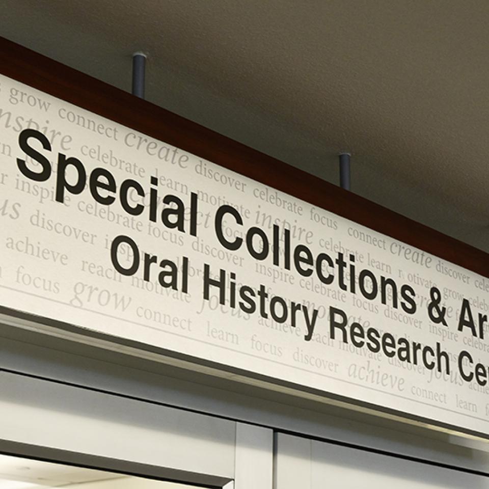 Sign reading "Special Collections & Archives Oral History Research Center" with a textured background.