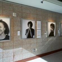 Wall with framed, black and photographs