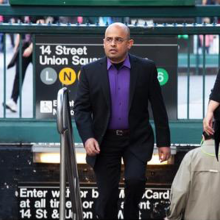 Dr. Aseem Inam walking out of New York subway station, image courtesy of Matthew Sussman
